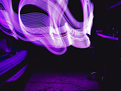 Symmetrical violet lines on dark background